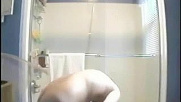 Clandestine Shower Cam Captures Big Tits Naked Girl