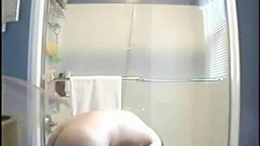 Clandestine Shower Cam Captures Big Tits Naked Girl