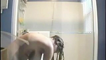 Clandestine Shower Cam Captures Big Tits Naked Girl