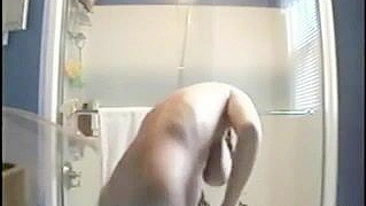 Clandestine Shower Cam Captures Big Tits Naked Girl