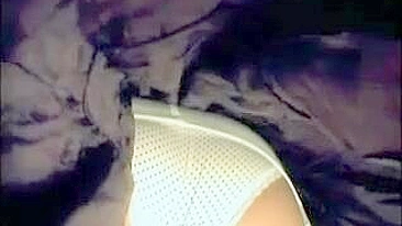 Sultry Woman In White Stockings Teases With Seductive Body Under Short Skirt