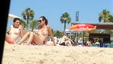 Nice Topless Beach Voyeur Video Of Two Naughty Ladies Filmed Half-Nude