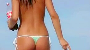 Beach-Going Babe's Boobs Bask In Sunshine During Public Topless Sunbath