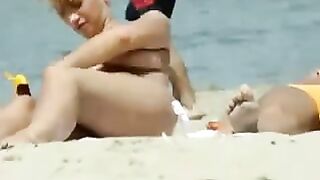 Sexy Girl With Big Boobs Oils Herself At Public Beach