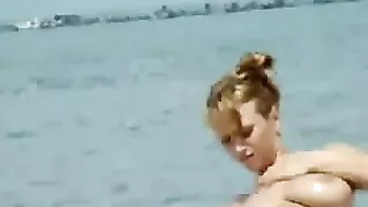 Sexy Girl With Big Boobs Oils Herself At Public Beach