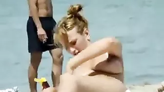 Sexy Girl With Big Boobs Oils Herself At Public Beach