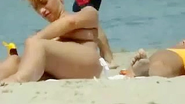 Sexy Girl With Big Boobs Oils Herself At Public Beach