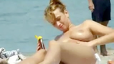 Sexy Girl With Big Boobs Oils Herself At Public Beach