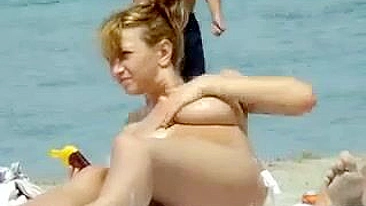Sexy Girl With Big Boobs Oils Herself At Public Beach