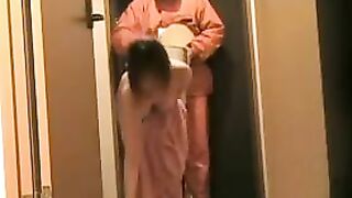 Asian Lady Flashes At The Door Secret Camera