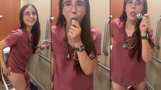 Naughty nurse playing with plug ass in the hospital toilet