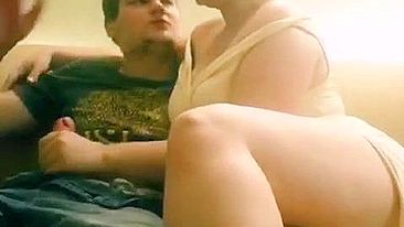 Mom lets out a piercing scream as she starts stroking son's cock