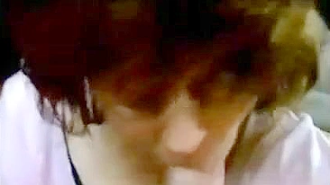 Gorgeous mom with curly hair is going to suck on that meaty boner too