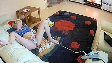 My friend’s sister masturbates a whole lot in living room with massager