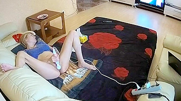 My friend’s sister masturbates a whole lot in living room with massager