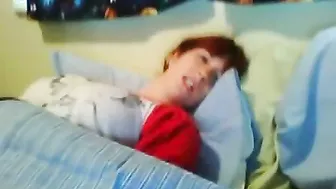 Hidden camera caught a red-haired bitch masturbating and catching an orgasm