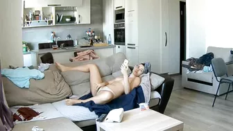 Hidden camera catches my girlfriend masturbating on the couch in front of the TV