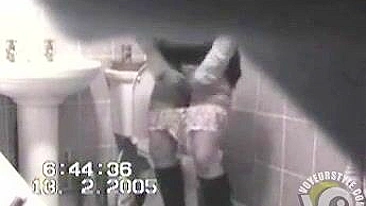 MILF in tight dress rubs her hairy pussy after the piss, but spy camera catch it all!