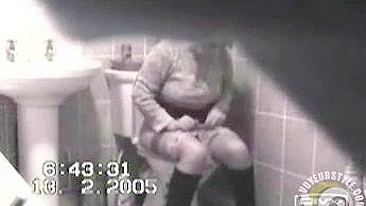 MILF in tight dress rubs her hairy pussy after the piss, but spy camera catch it all!