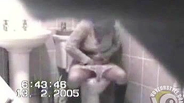 MILF in tight dress rubs her hairy pussy after the piss, but spy camera catch it all!