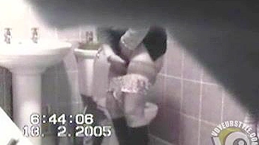 MILF in tight dress rubs her hairy pussy after the piss, but spy camera catch it all!