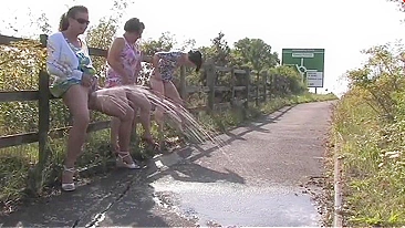 Three British drunk mature sluts and one big fountain of piss play a game of who can go piss the most