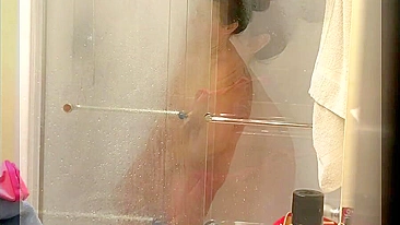 Spy, Voyeur, Big-breasted mom Masturbates in the shower using a shower head and a jet of water