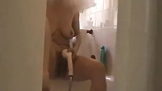 Spy, masturbation in the shower, mom self-satisfied using a shower head and a jet of water