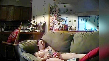 A hidden camera installed by me in the living room catches daughter watching porn and masturbating