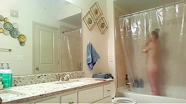 Athletic Sister Caught Pleasuring Herself with Shower Head on Hidden Cam