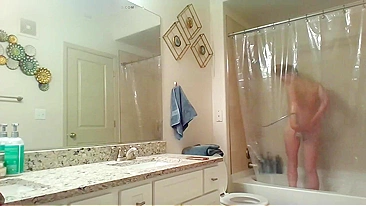 Athletic Sister Caught Pleasuring Herself with Shower Head on Hidden Cam