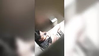 A beautiful lady was filmed with a hidden camera in the toilet with her panties down and fingering