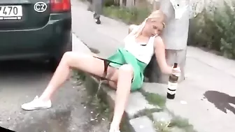 Drunk German woman pisses on street with beer