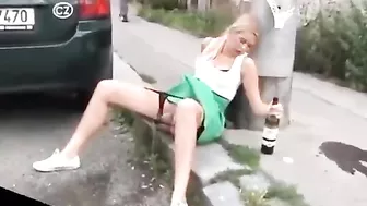 Drunk German woman pisses on street with beer