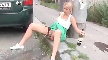 Drunk German woman pisses on street with beer