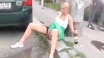 Drunk German woman pisses on street with beer
