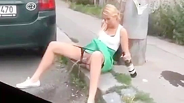 Drunk German woman pisses on street with beer