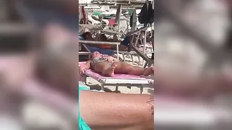 Horny MILF Caught Fingering Her Wet Pussy in Public Beach Crowd - Voyeur Spy Cam!