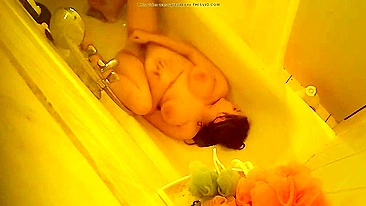 Mom’s Caught Naked & Moaning While Fingering Her Wet Pussy in Mirror Using a Stream of Water