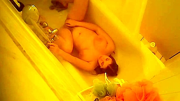 Mom’s Caught Naked & Moaning While Fingering Her Wet Pussy in Mirror Using a Stream of Water