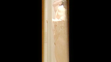 Dude son's cam trap films hot mom's shaved pussy n bouncy boobs showerin